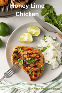 "Grilled honey lime chicken breast served with fluffy white rice and fresh cilantro, garnished with lime wedges on a white plate — a light and flavorful dinner idea perfect for summer meals."